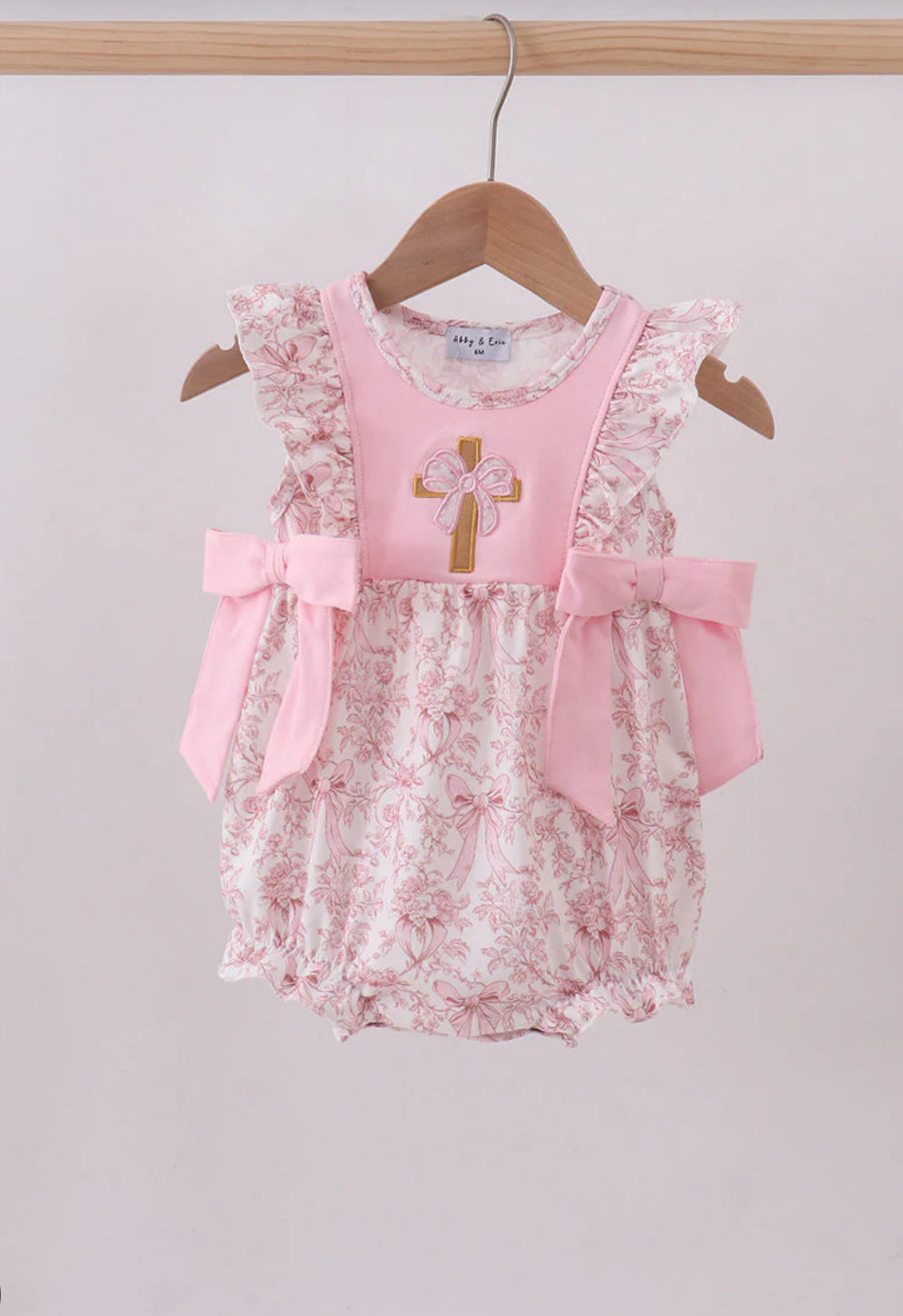 Pink bowknot cross applique ruffle bubble