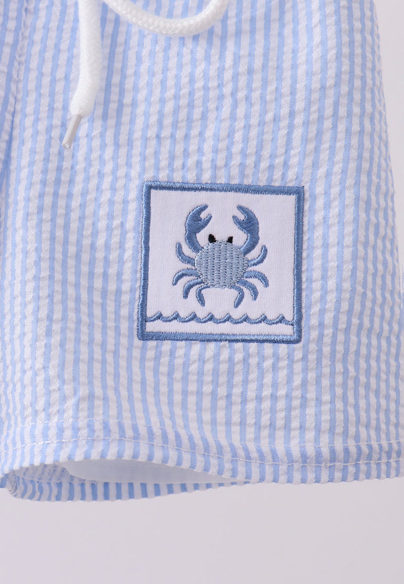 Blue stripe seersucker crab embroidery swim trunks