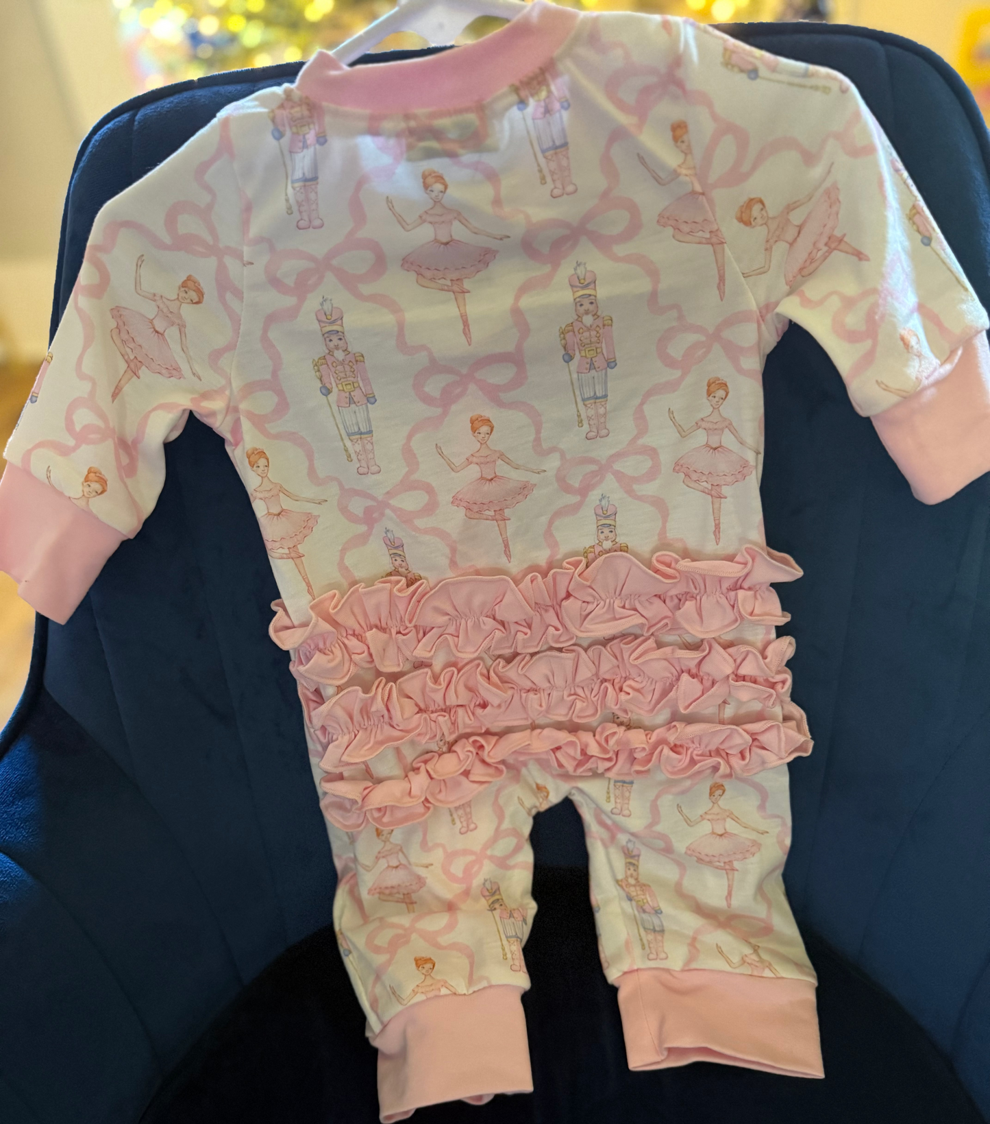 Pink nutcracker print ruffle romper